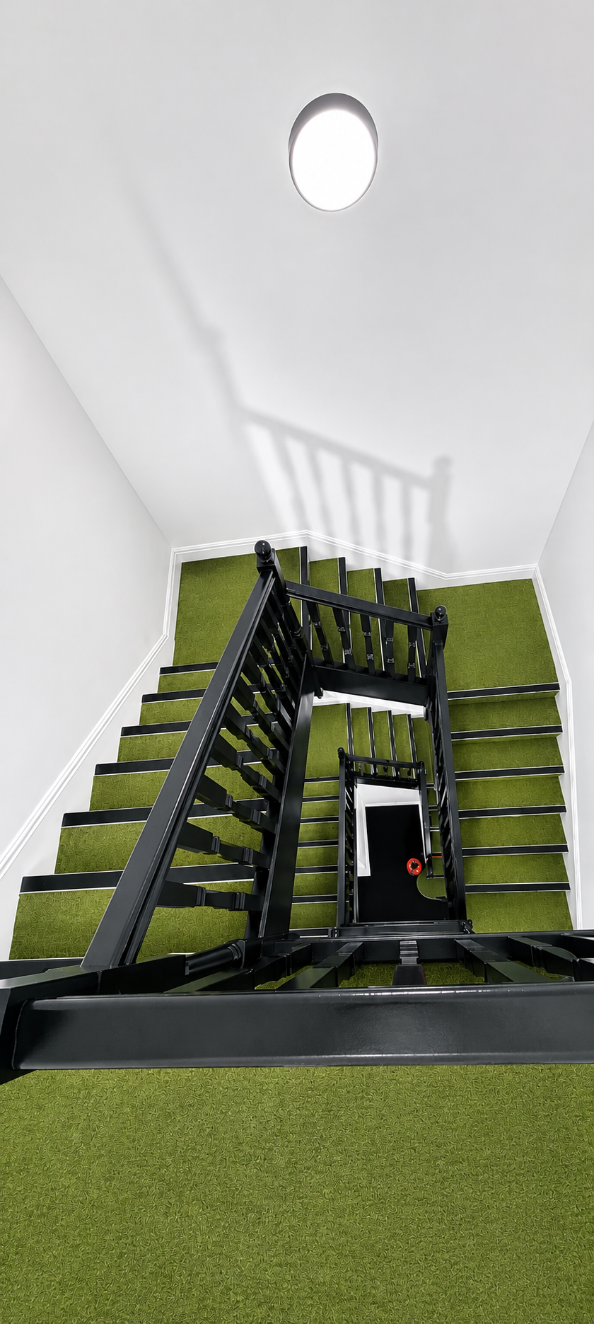 Green & Olive staircase with olive green carpet